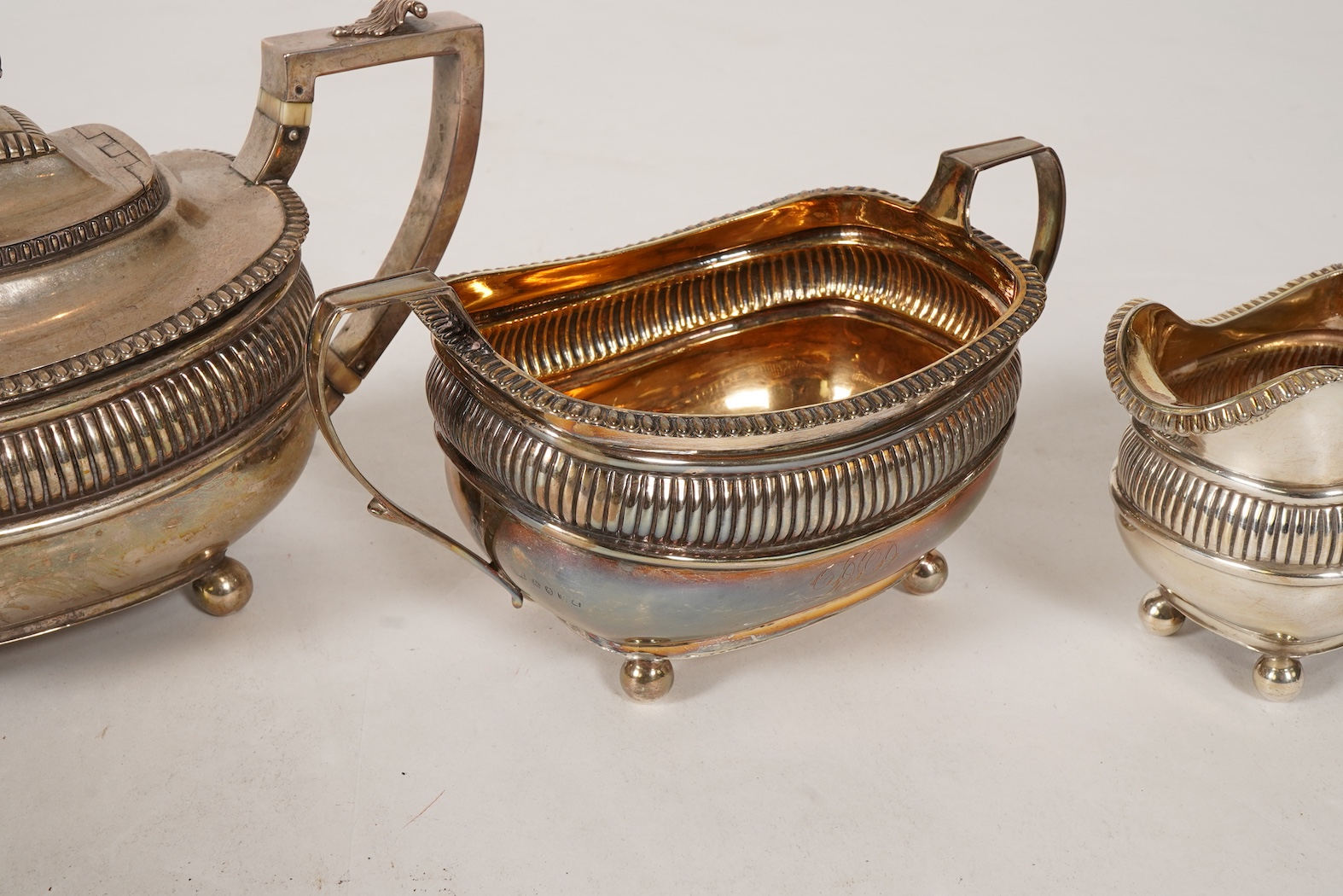 A George III silver three piece tea set, by John Wakefield